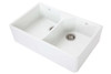 Whie double bowl butler sink with stainless steel basket waste, overflow and no tap hole.