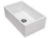 Large, white butlers sink with stainless steel waste basket.