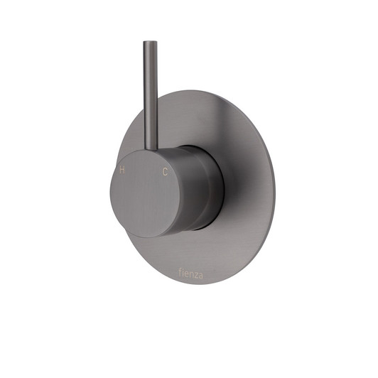 Gun metal round mixer with small round pin handle mixer pointing upwards and large round backing plate.