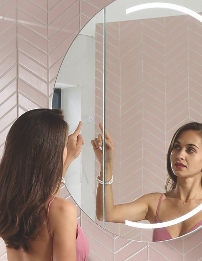 Women using touch sensor on pearl mirror