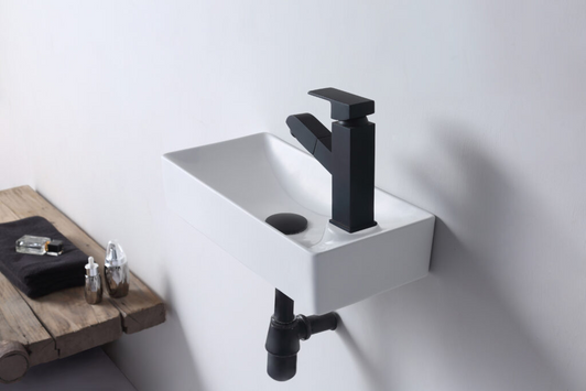 Tyrrell wall hung compact basin, live shot shown with a black square tap, waste and pipe.