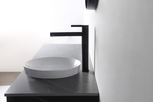 Gardinier round white ceramic semi in-set basin, live shot with black mixer Gardinier round white ceramic semi in-set basin, live shot with black mixer