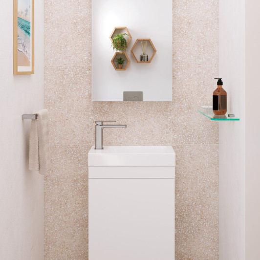 live shot of the Tono basin mixer in brushed nickel by Fienza. Installed on a small white vanity.