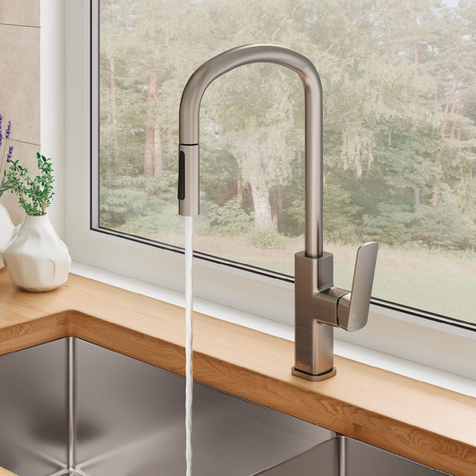 Live image of the brushed nickel Tono kitchen or laundry pull-out sink mixer by Fienza. Installed on a wooden bench with brushed nickel sink. Live image of the brushed nickel Tono kitchen or laundry pull-out sink mixer by Fienza. Installed on a wooden bench with brushed nickel sink.