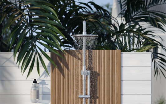 Outdoor Soap Dispenser Bracket pictured in an outdoor shower.