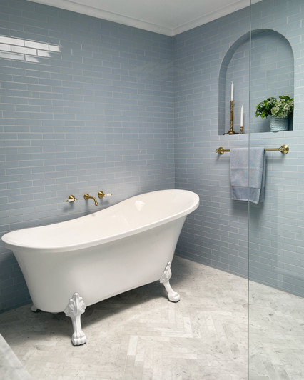 Clawfoot Freestanding Acrylic Bath with Semi-Gloss White Feet. Pictured with urban brass tapware and accessories.