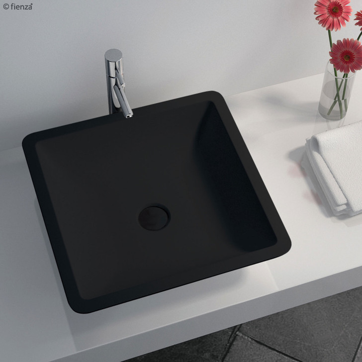 Matte black cast stone above counter square basin with matching pop-up.