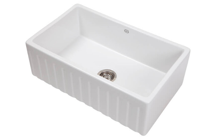 Large white kitchen or laundry sink. ribbed front panel. Stainless steel basket waste.