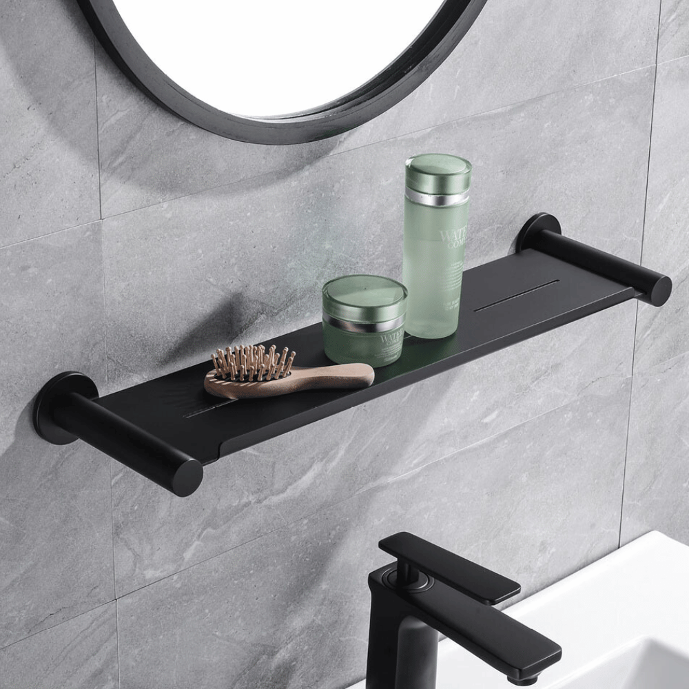 Matte black shelf mounted between a mirror and vanity.