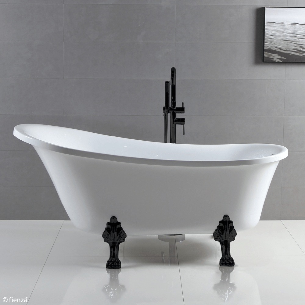 Clawfoot bath with matte black legs. The floor mounted matte black bath mixer is centered on the long side of the bath