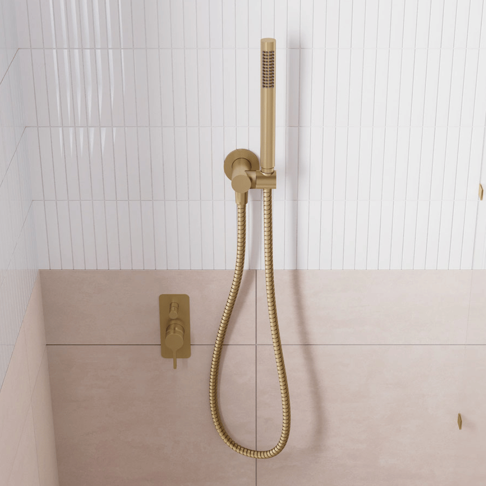 Urban brass shower hose on a hook with matching shower mixer and diverter.