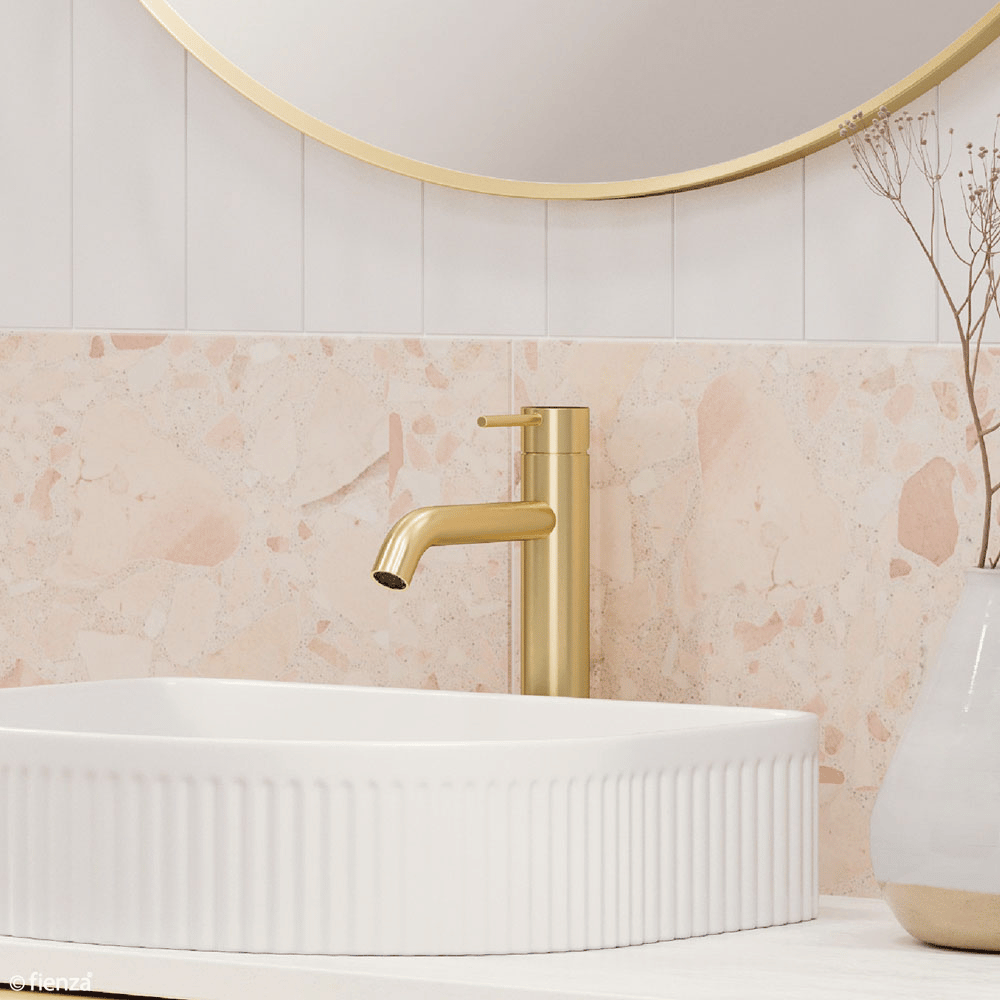 Urban brass tall basin mixer above the Eleanor arch fluted, above counter basin.