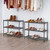 Two three tier metal slat shoe racks with shoes on each shelf next to each other in a closet