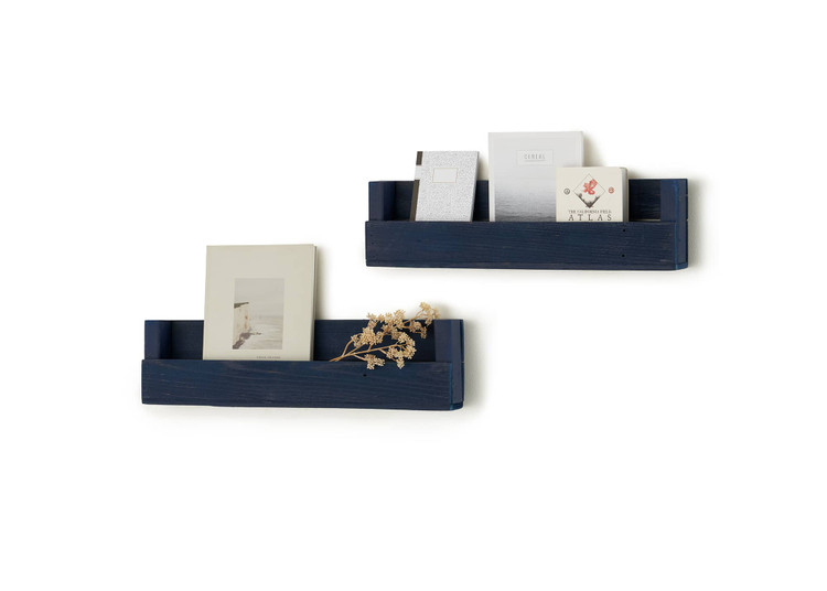 two rustic style wall shelves in navy blue, filled with journals and books
