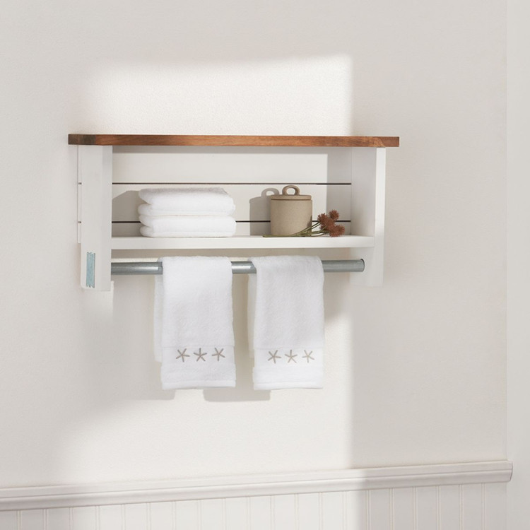 White farmhouse style bathroom wall shelf with towels and container