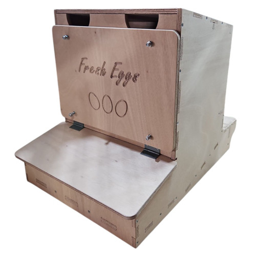 The external view of the reverse rollaway nesting box showcasing the engraved "Fresh Eggs" panel on the egg collection section. The panel is securely mounted to the box, providing a durable and stylish finish. The external view of the reverse rollaway nesting box showcasing the engraved "Fresh Eggs" panel on the egg collection section. The panel is securely mounted to the box, providing a durable and stylish finish.