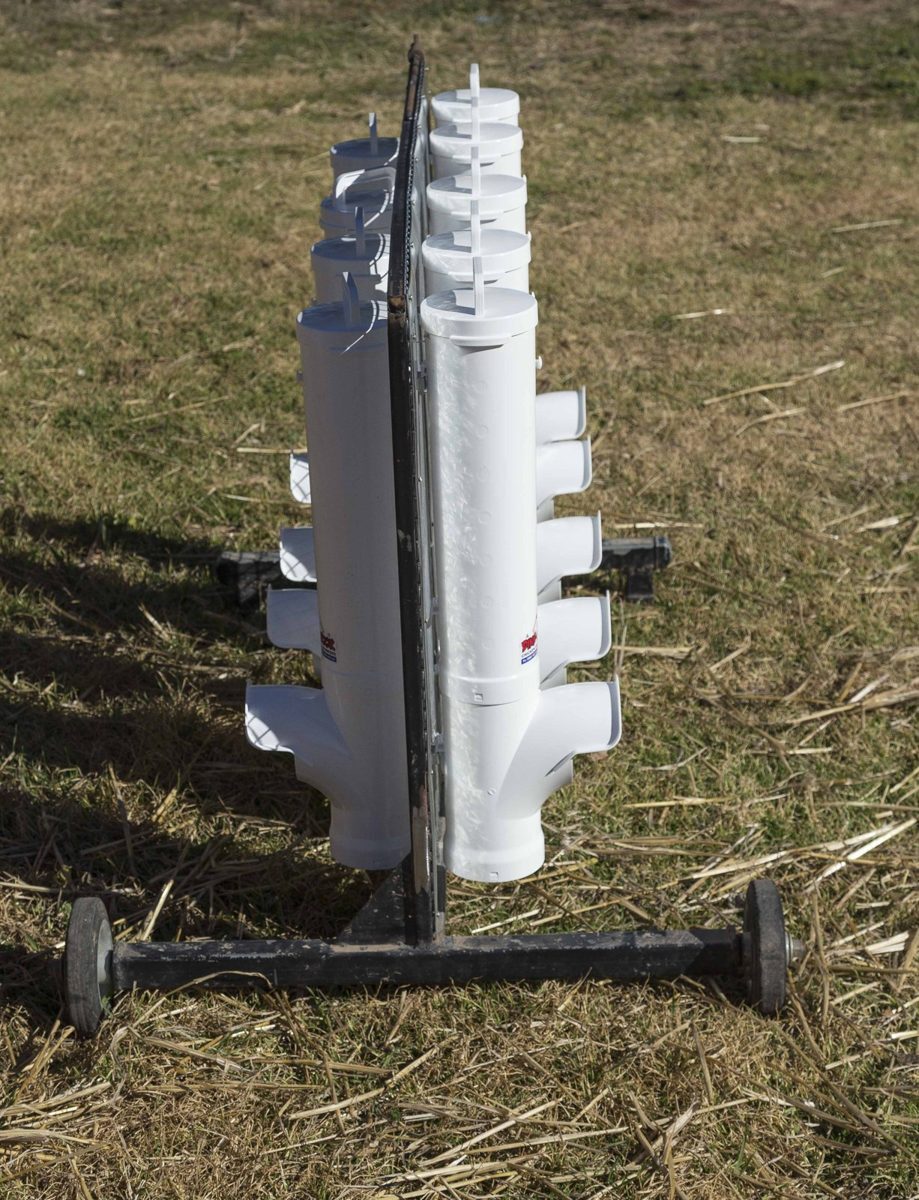 Side view of a wheeled feeder trolley with Dine-A-Chook feeders on both sides