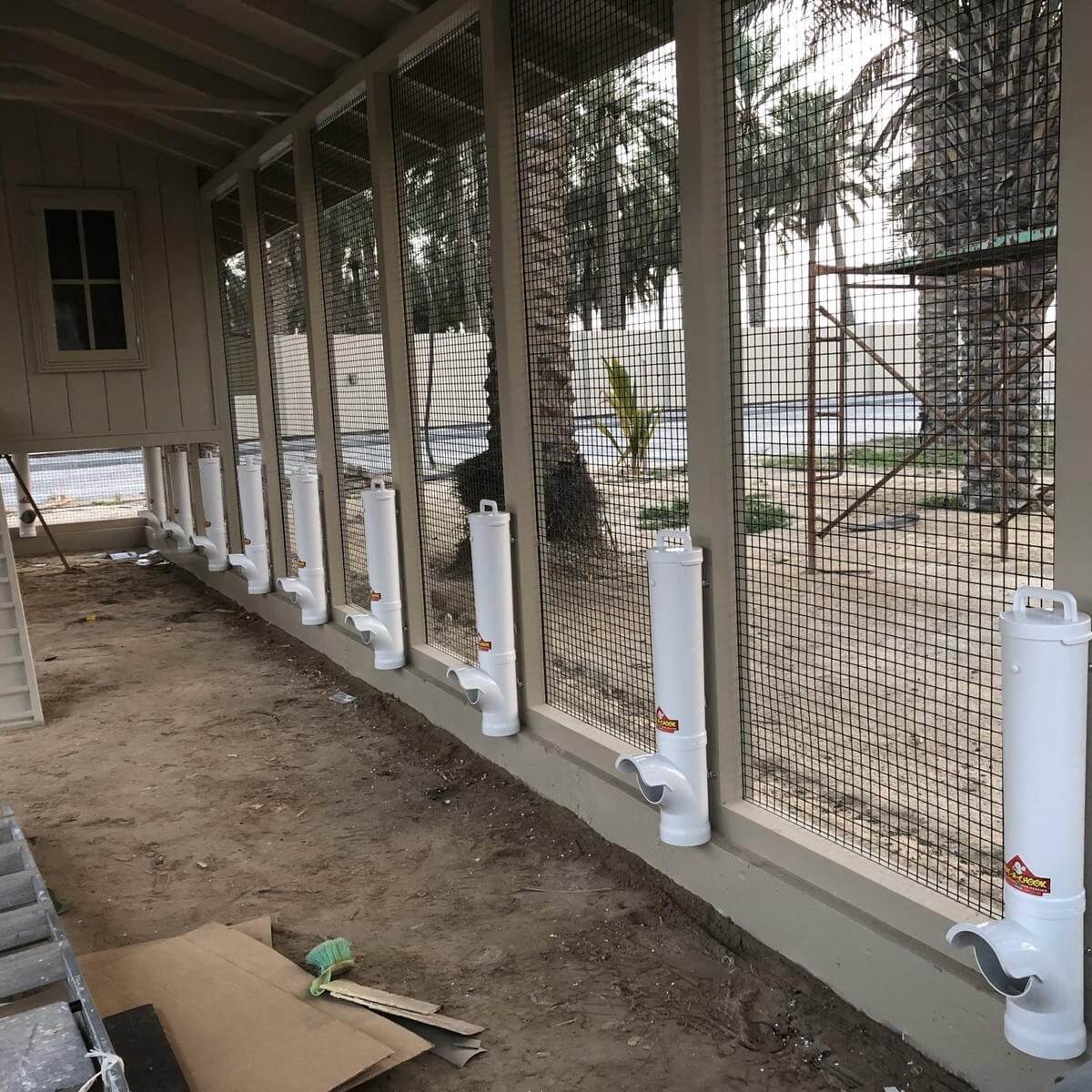 Large coop with multiple Dine-A-Chook feeders in the UAE