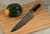 Shun Classic 10" Chef Knife (DM0707) lying on a cutting board