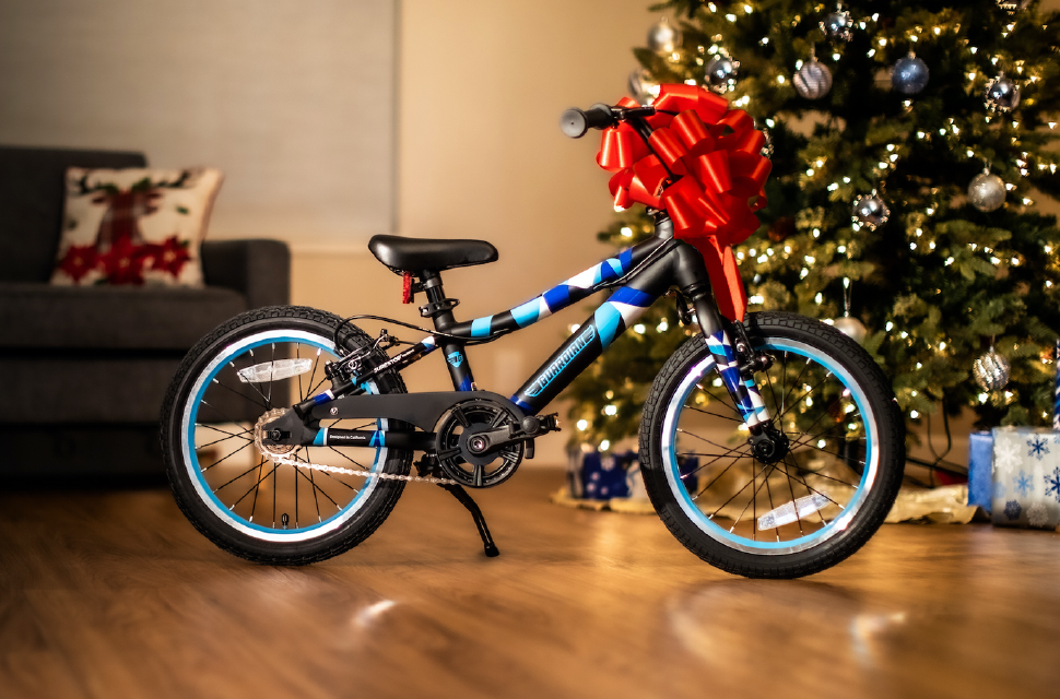 Big bow on a bike as a present under the Christmas tree - Eurocycles Ireland