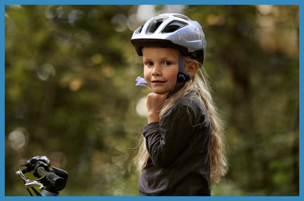 Girl wearing a Scott cycling kids helmet - Eurocycles Ireland