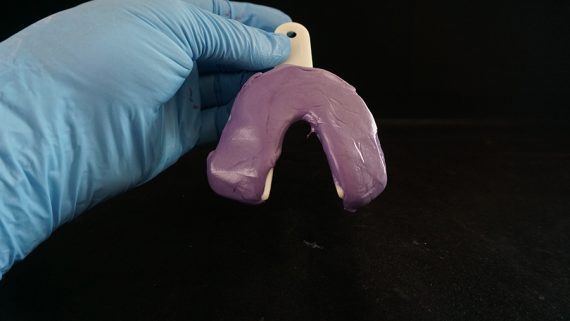 Lower tray filled with putty