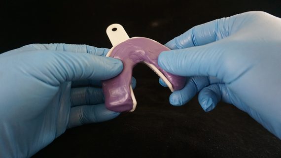 Spread lower putty in tray