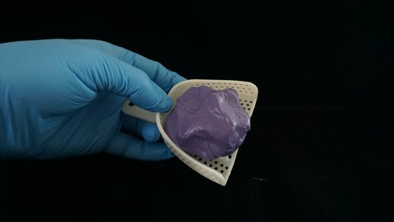 Place putty into tray