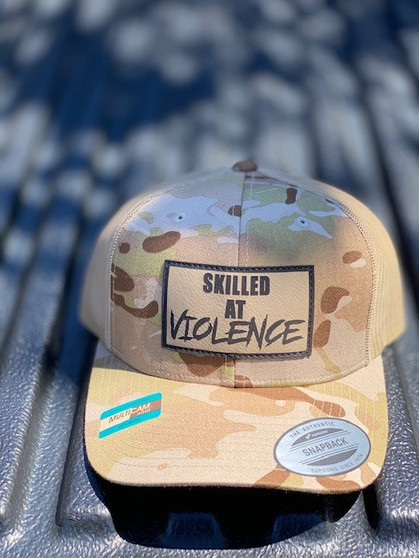 SKILLED AT VIOLENCE TRUCKER HAT (Multicam Arid)