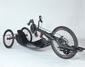 3/4 view of the Carbonbike R-2020 handcycle featuring a slim aerodynamic frame designed for speed, efficiency, and smooth performance.