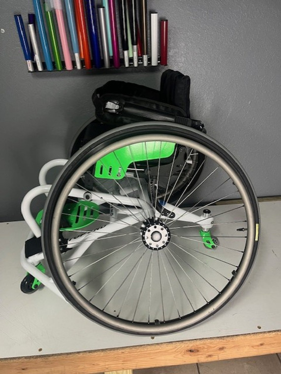 A lightly used, white snow,  ProBB basketball chair!