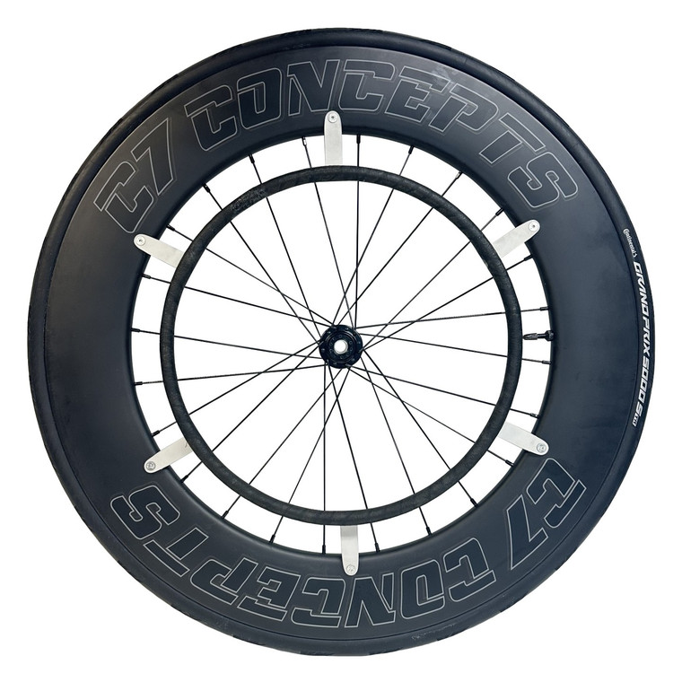 Front view of the C7 Racer 700c wheelchair racing wheel set with 90mm deep carbon rims and double-crossed spokes, designed for racing chairs with pushrim sizes 14.5"–15.5", built for speed and stiffness.