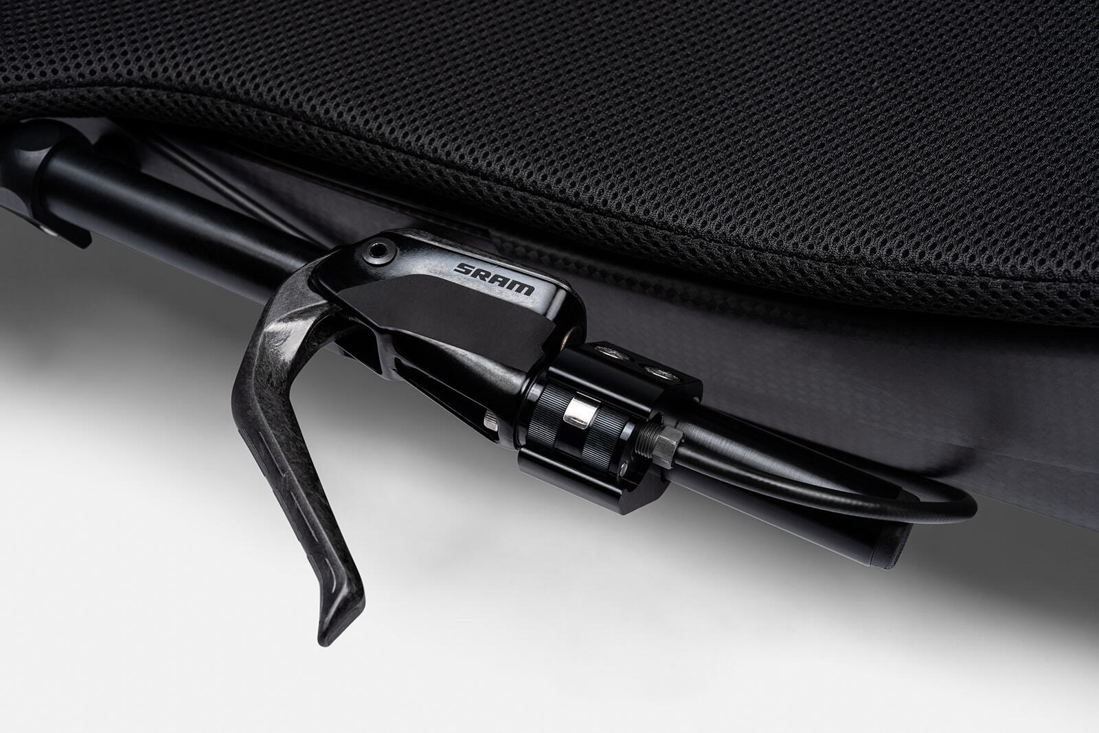 The Vento Handcycle includes a SRAM braking system. The image is of a brake handle that is locates on the frame of the bike.
