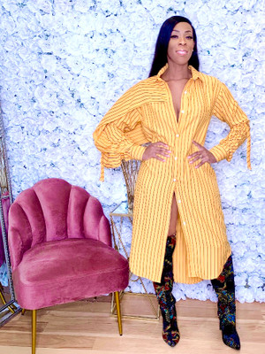 Oversized Button Down Shirt Dress with Back Overlay, One Sleeve Draping and Ruched Sleeve Ties in Mustard with Black Stripes
95% Cotton
5% Spandex