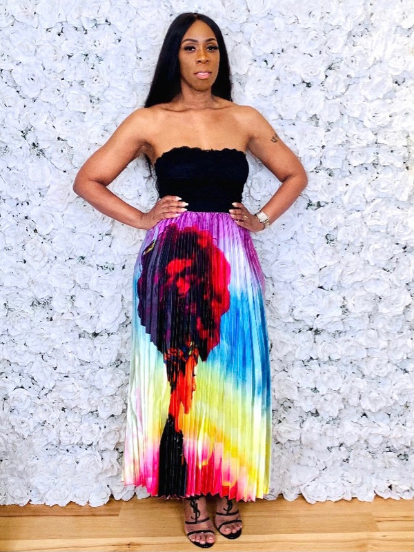 Pleated Maxi Skirt with Banded Waist in a Multicolored Print of A Black Woman's Natural Crown.