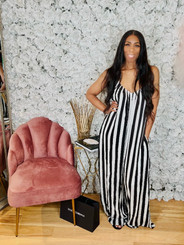 Oversized Wide Leg Jumpsuit with Adjustable Shoulder Straps, Invisible Zipper and Side Pockets in Black and White Stripes.
Fully Lined
100% Polyester