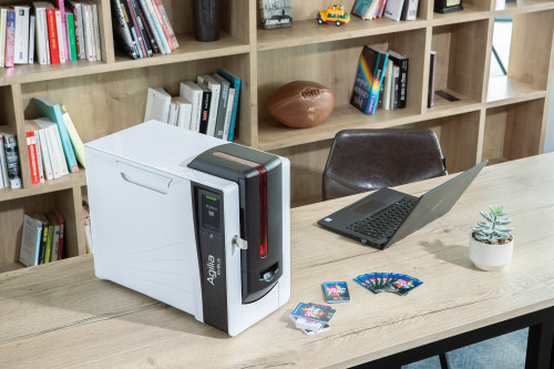 Evolis Agilia ID card printer in use on an office desk