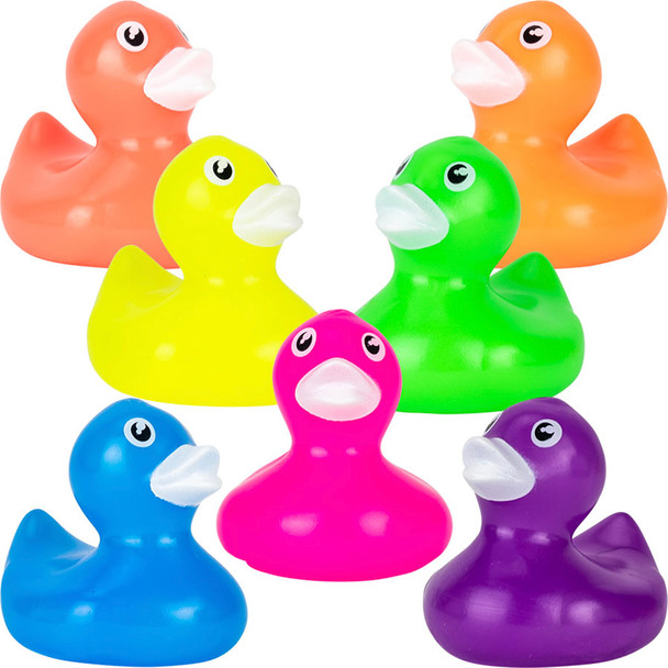 Fluorescent Rubber Ducklings with white beaks, in the light