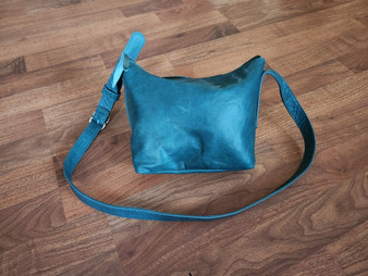Distressed leather crossbody bag