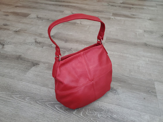 Red leather bag in hobo style