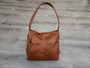 Brown shoulder handbag with front pockets