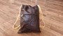 Brown leather sackpack bag