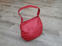 Red leather bag in hobo style