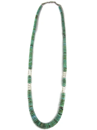 A beautiful turquoise bead necklace rests gracefully on a rustic wooden background.