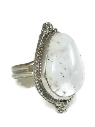 Handcrafted white buffalo rings featuring natural black and white stone.