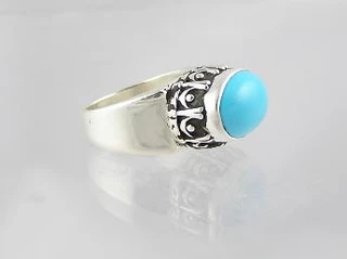 A handcrafted sterling silver ring features a vibrant blue Sleeping Beauty turquoise stone.