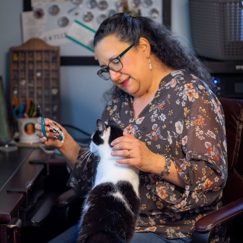 Artist Cindy Battisti at work making bracelets. 