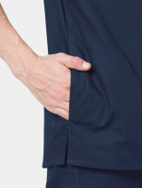 A close up view of the right side pocket on the Carhartt mens scrub top C16418 in navy
