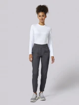 Full-length model view of Cherokee Workwear Revolution Women's Natural Rise Jogger Scrub Pant WW011 in Pewter
