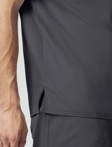 Side vent detail of Cherokee Workwear Revolution Men's Tuckable V-Neck Scrub Top WW690 in Pewter
